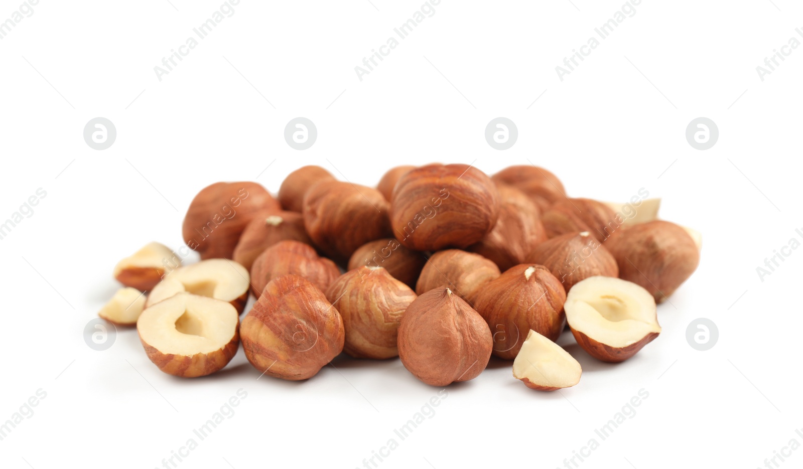 Photo of Heap of tasty hazelnuts on white background