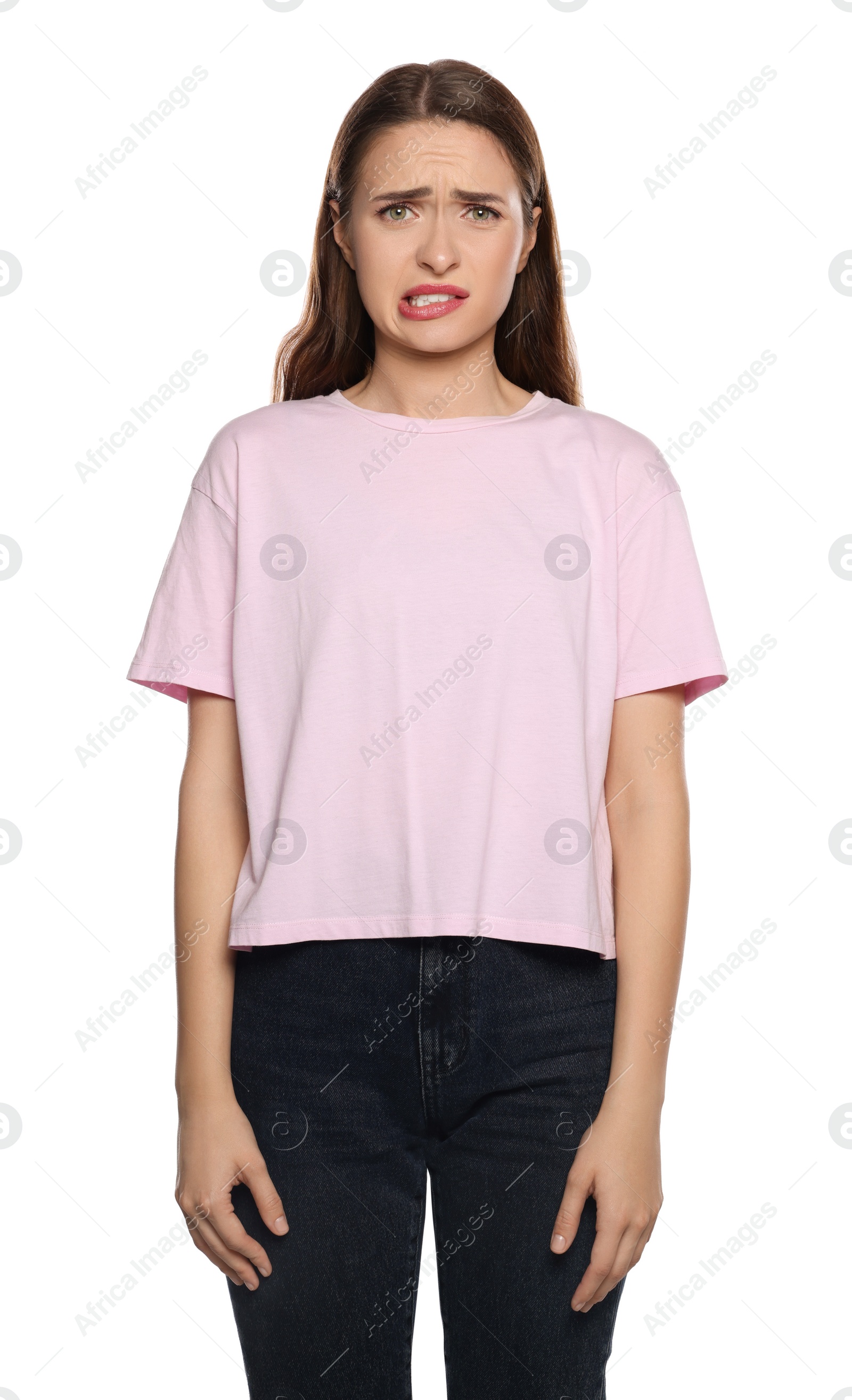 Photo of Embarrassed young woman in shirt on white background