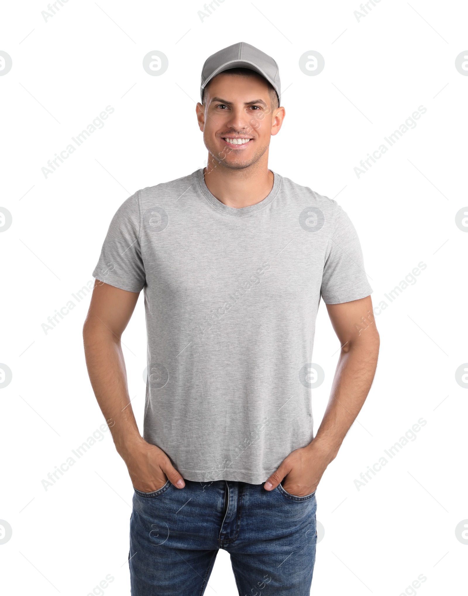 Photo of Happy man in grey cap and tshirt on white background. Mockup for design