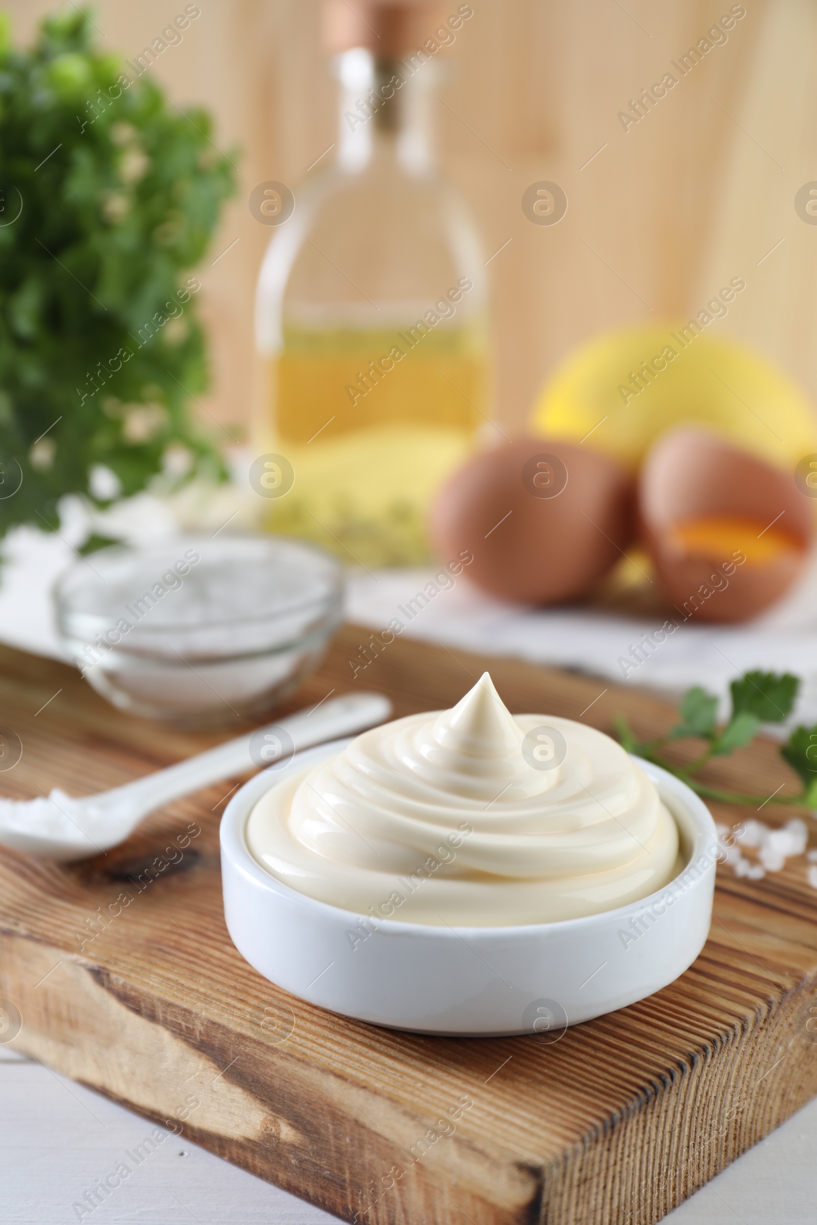 Photo of Fresh mayonnaise sauce in bowl on table