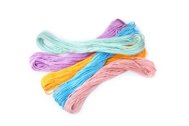 Photo of Set of colorful embroidery threads on white background, top view