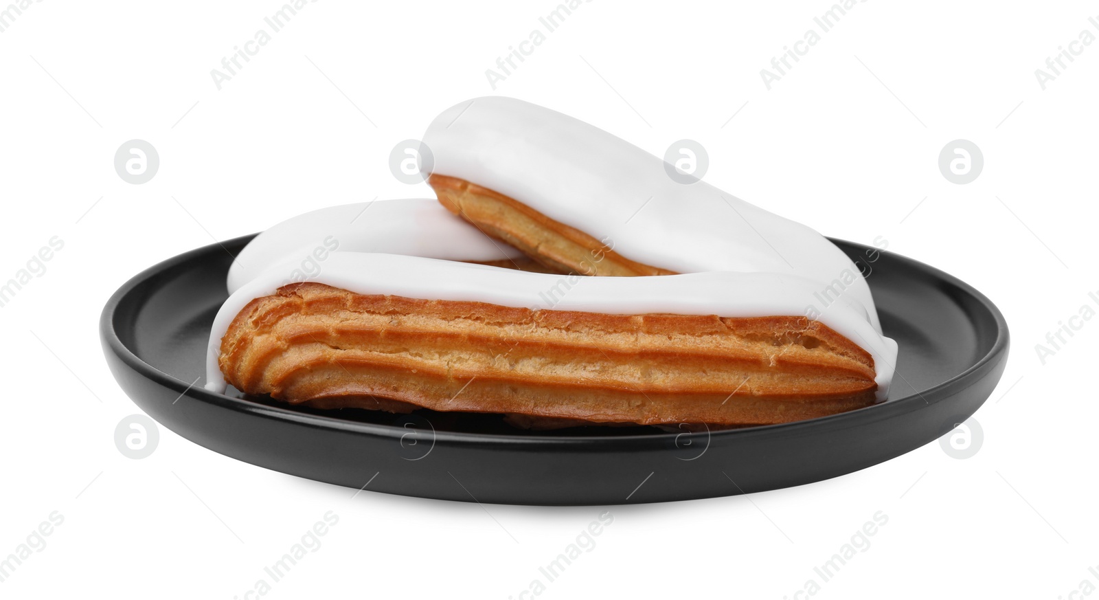 Photo of Delicious eclairs covered with glaze isolated on white