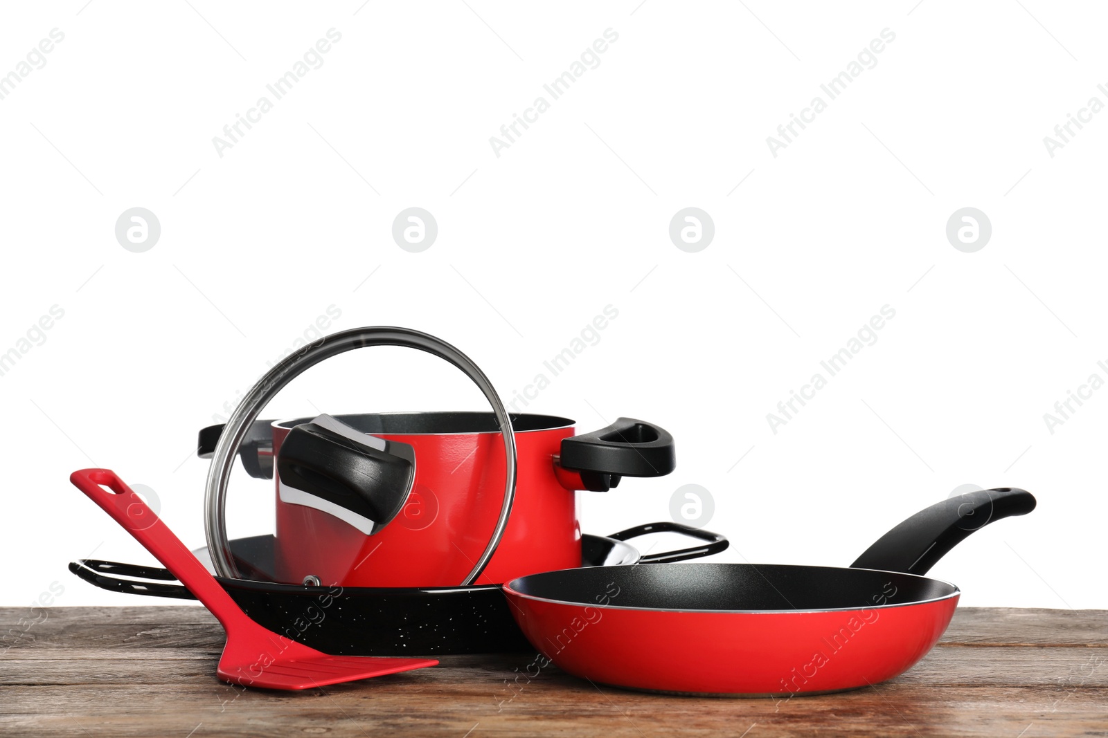 Photo of Set of clean cookware on table against white background