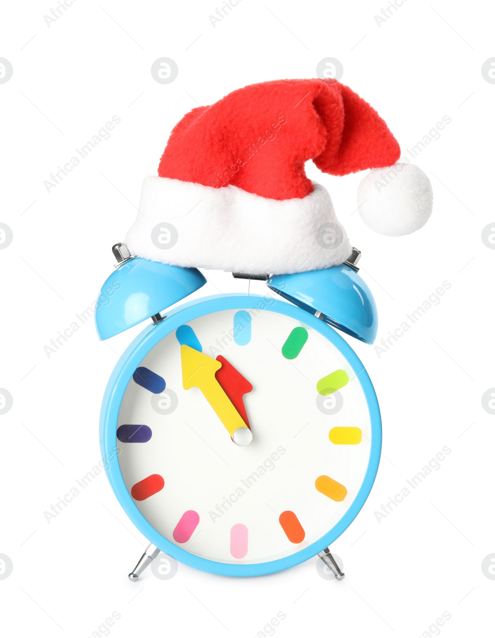 Photo of Alarm clock with Santa hat on white background. New Year countdown