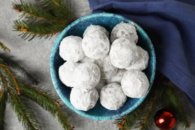 Flat lay composition with Christmas snowball cookies on grey table