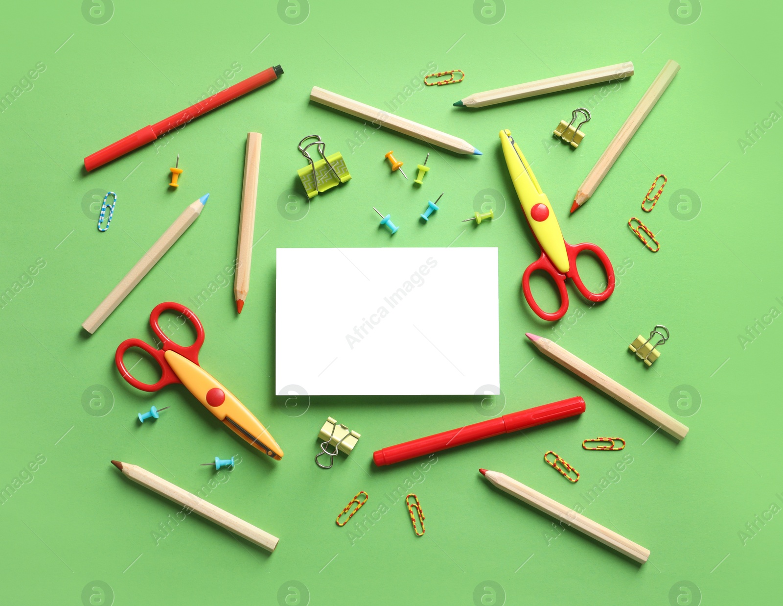 Photo of Flat lay composition with scissors and school supplies on color background. Space for text