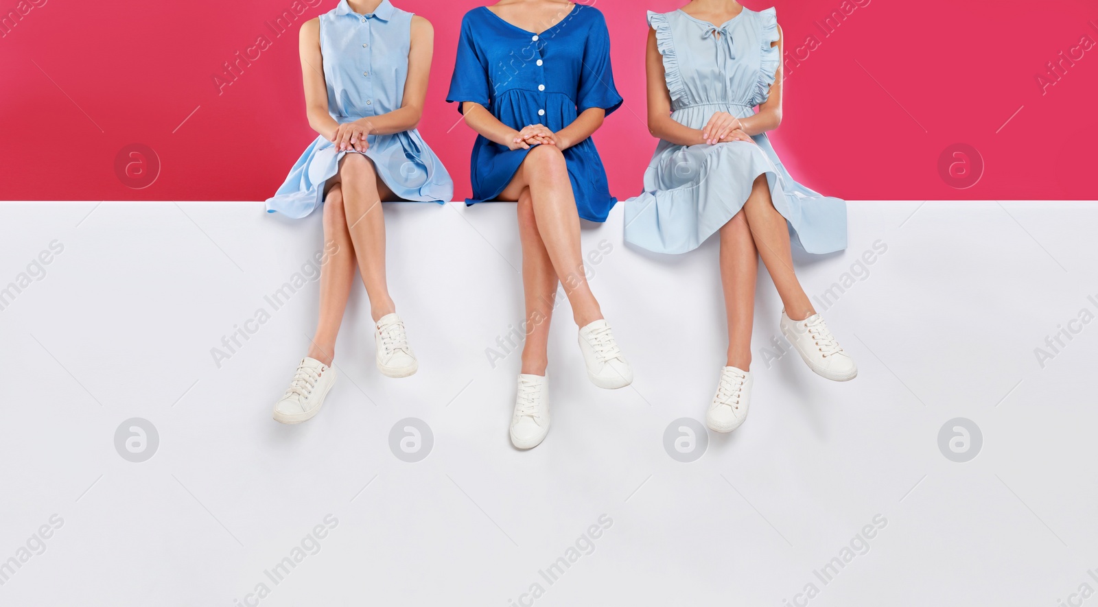 Photo of Women wearing stylish shoes on color background, closeup