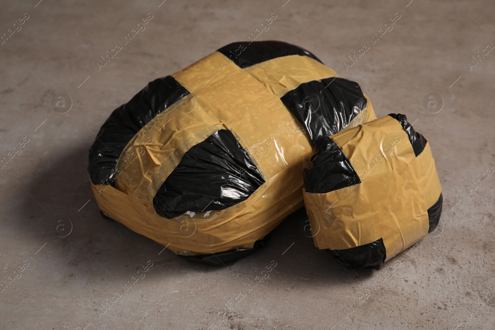 Photo of Packages with narcotics on grey textured table