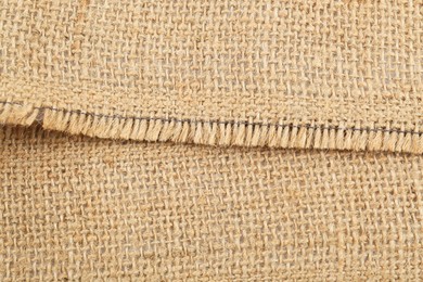 Photo of Texture of burlap fabric as background, closeup