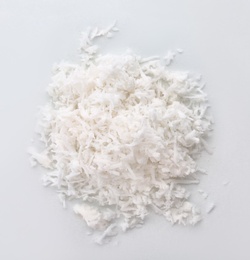 Photo of Fresh coconut flakes on white background