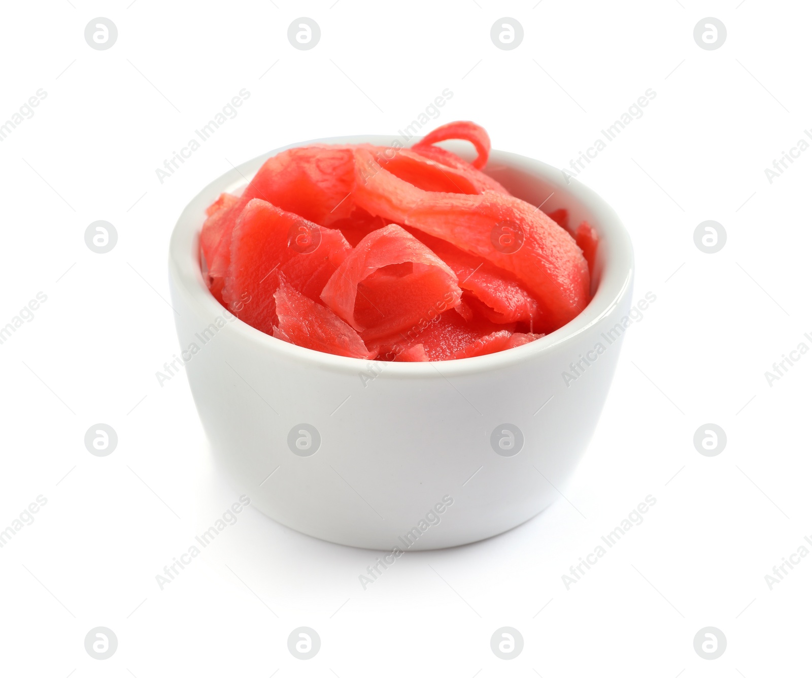 Photo of Piquant pickled ginger in bowl on white background.  Delicious sauce condiment