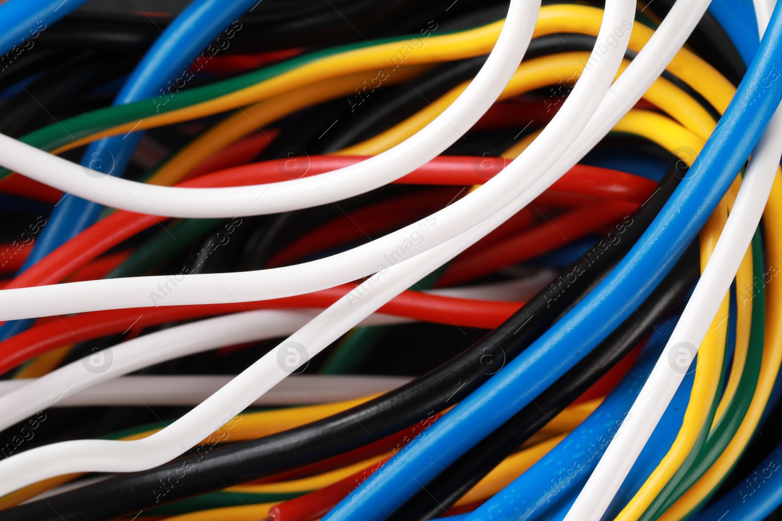 Photo of New colorful electrical wires as background, closeup