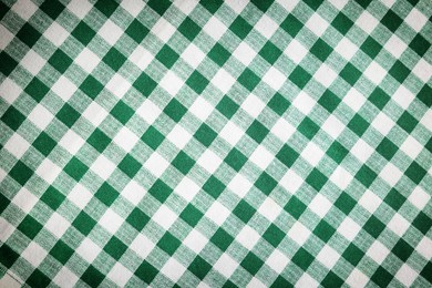 Green and white tablecloth as background, vignette effect