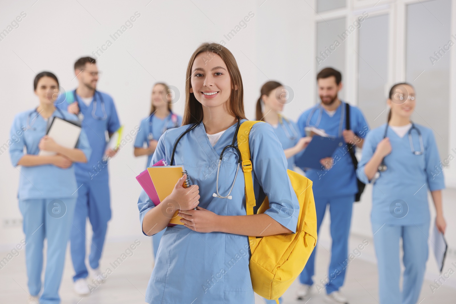 Photo of Young medical student with her classmates in university