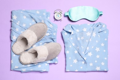 Photo of Flat lay composition with comfortable pajamas on violet background