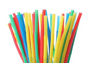 Many colorful cocktail straws on white background