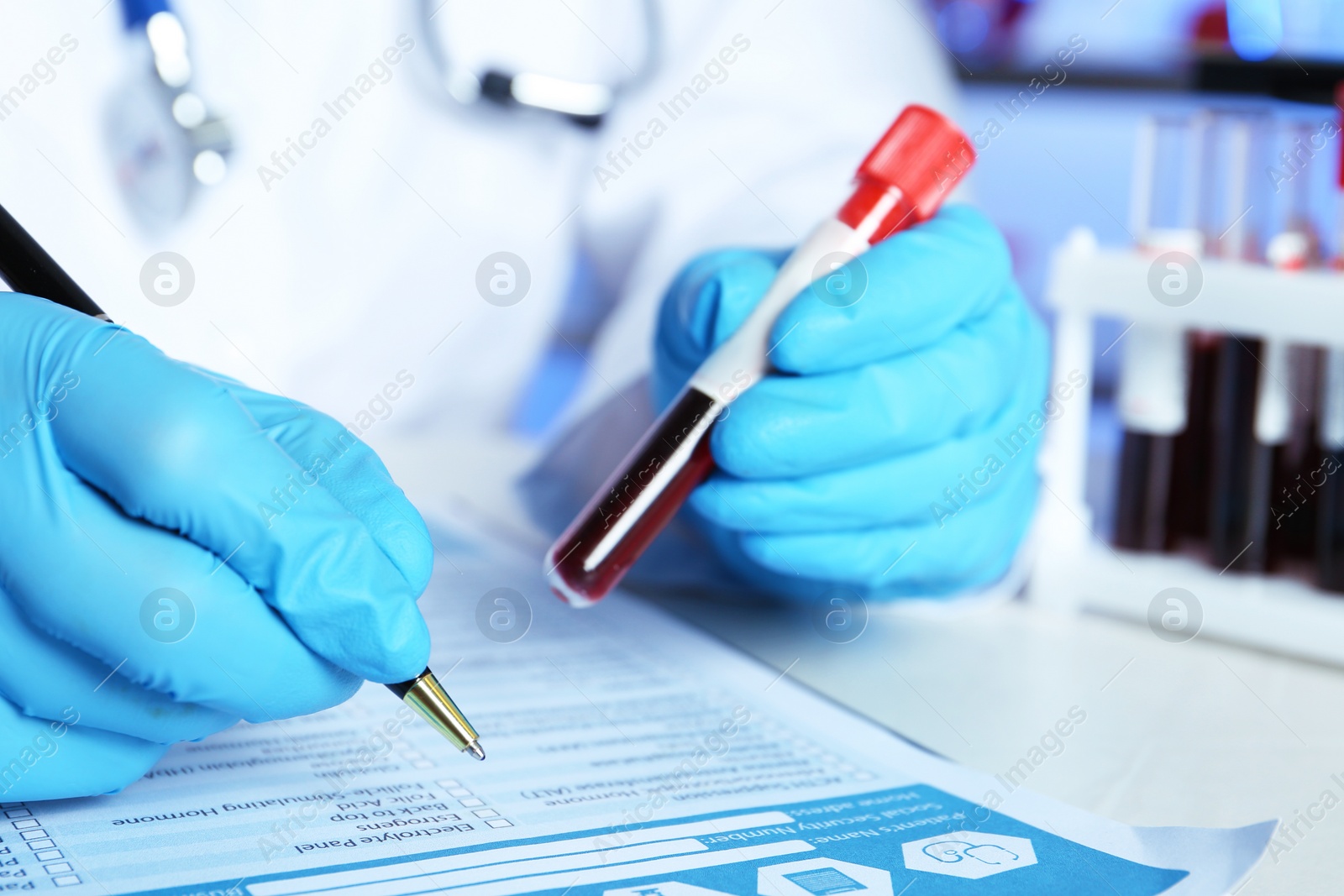 Photo of Scientist working at table in laboratory, closeup. Research and analysis