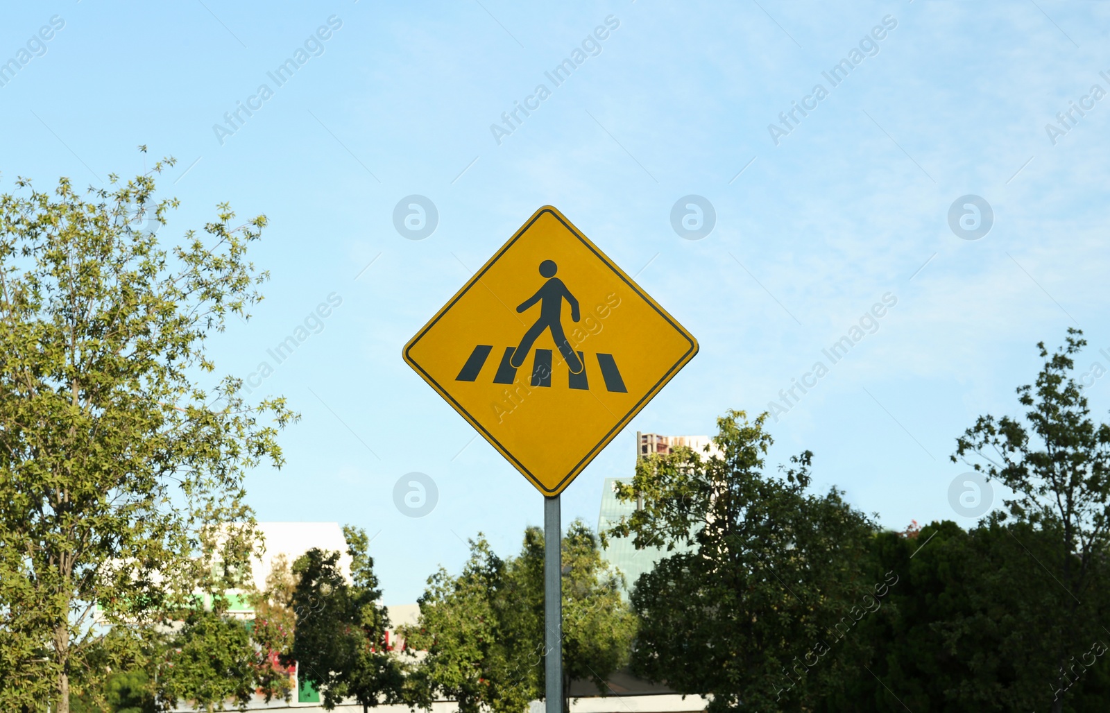 Photo of Different road signs on city street against blue sky