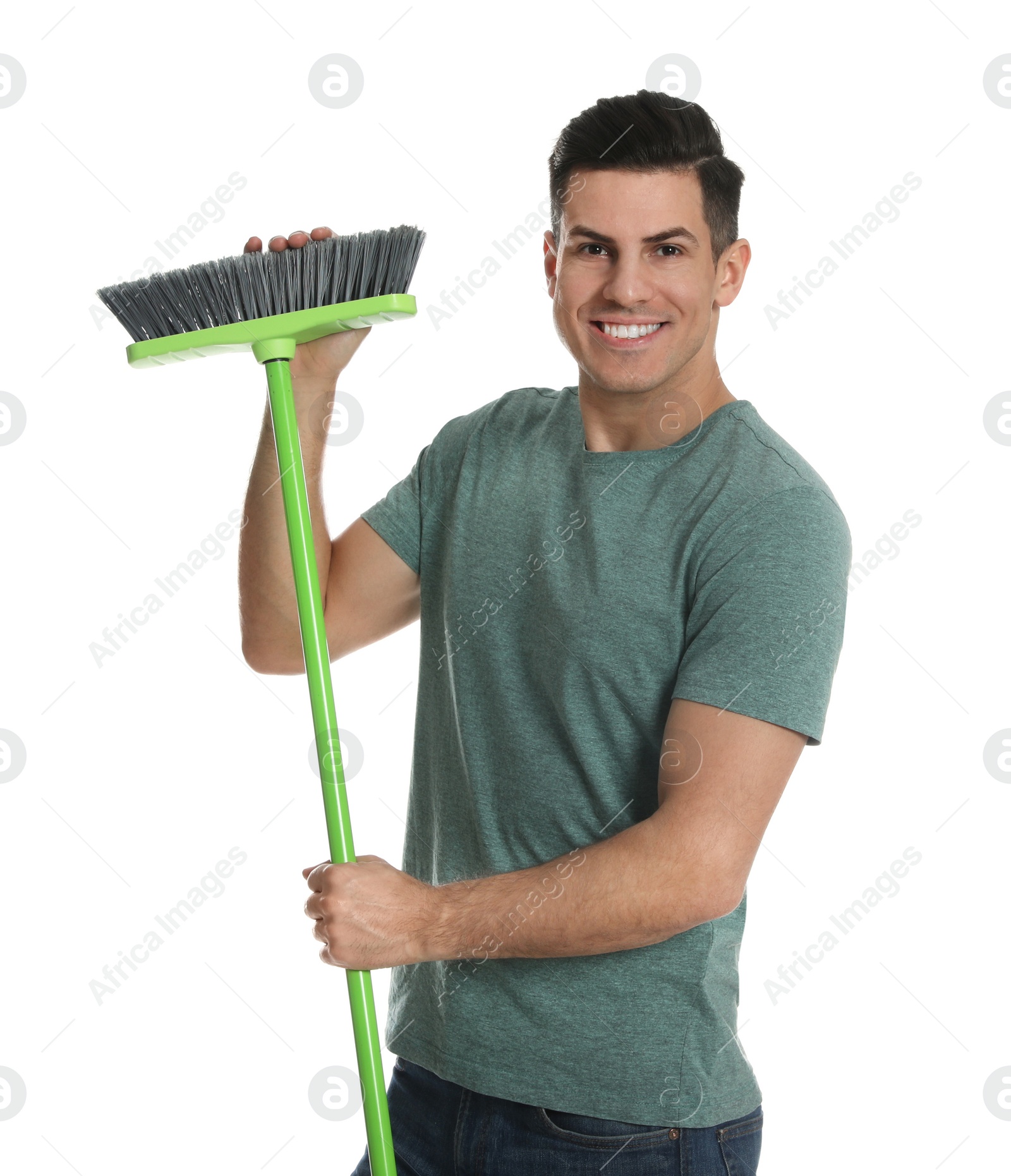 Photo of Man with green broom on white background