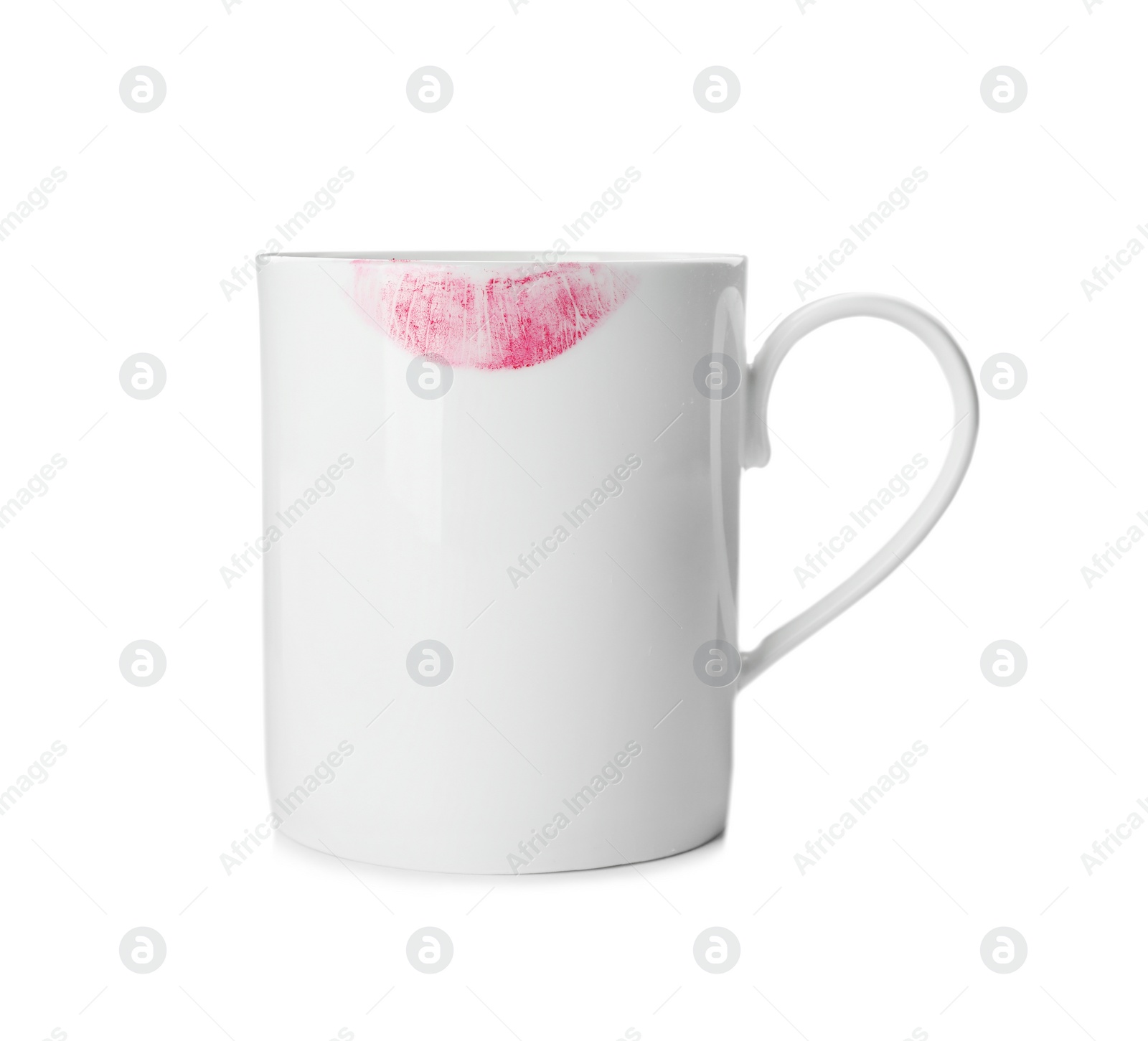 Photo of Ceramic cup with lipstick mark on white background