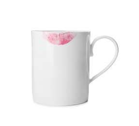 Photo of Ceramic cup with lipstick mark on white background