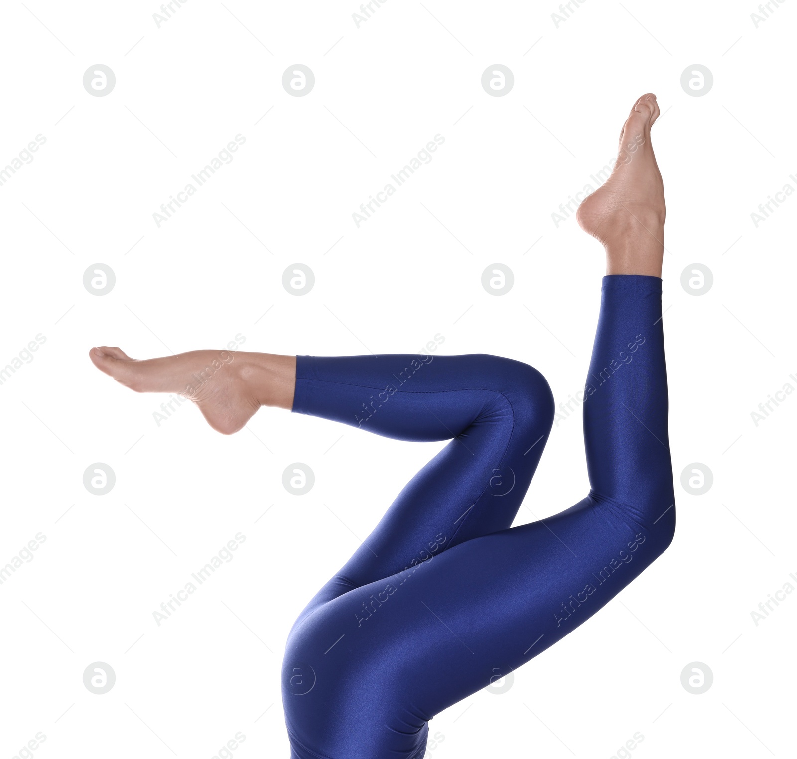 Photo of Woman with beautiful long legs wearing blue leggings on white background, closeup