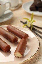 Photo of Glazed vanilla curd cheese bars served on beige table