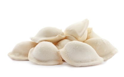 Photo of Heap of raw dumplings on white background