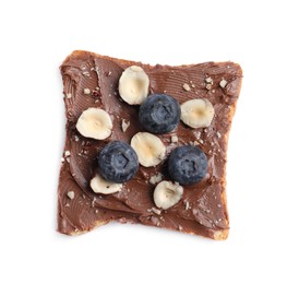 Photo of Toast with tasty nut butter, blueberries and nuts isolated on white, top view