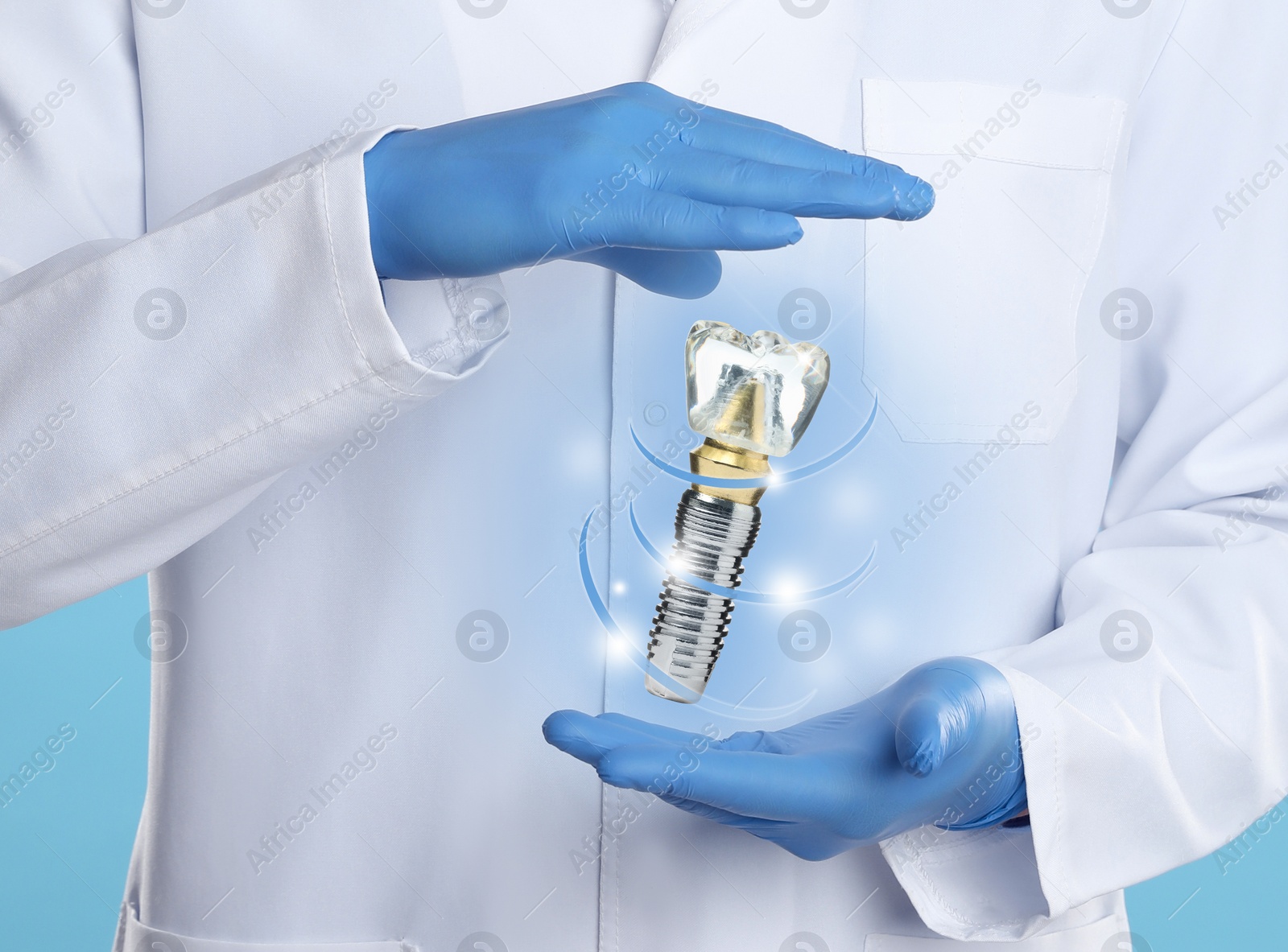 Image of Doctor demonstrating virtual model of dental implant on light blue background, closeup