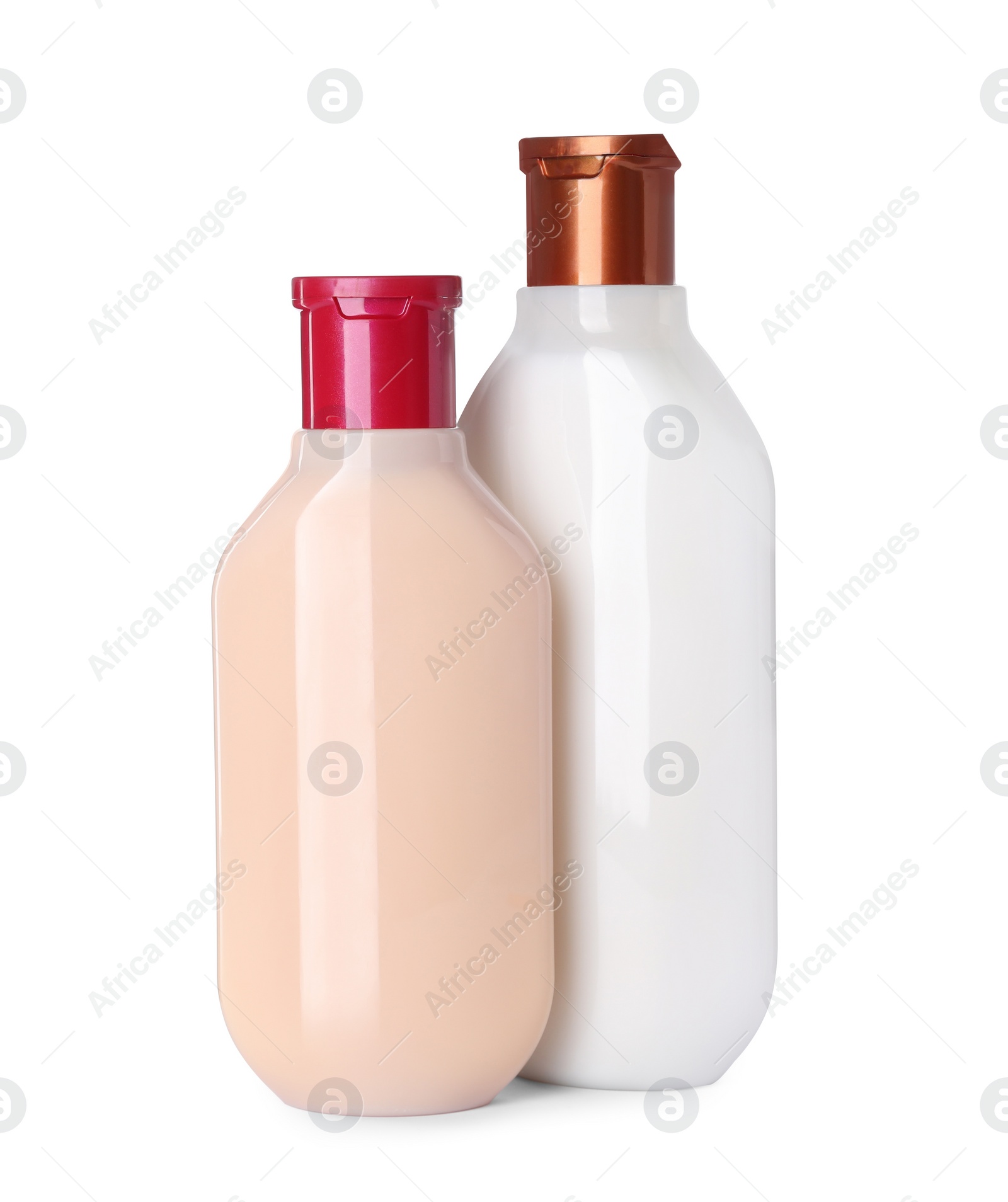 Photo of Different bottles of shampoo on white background