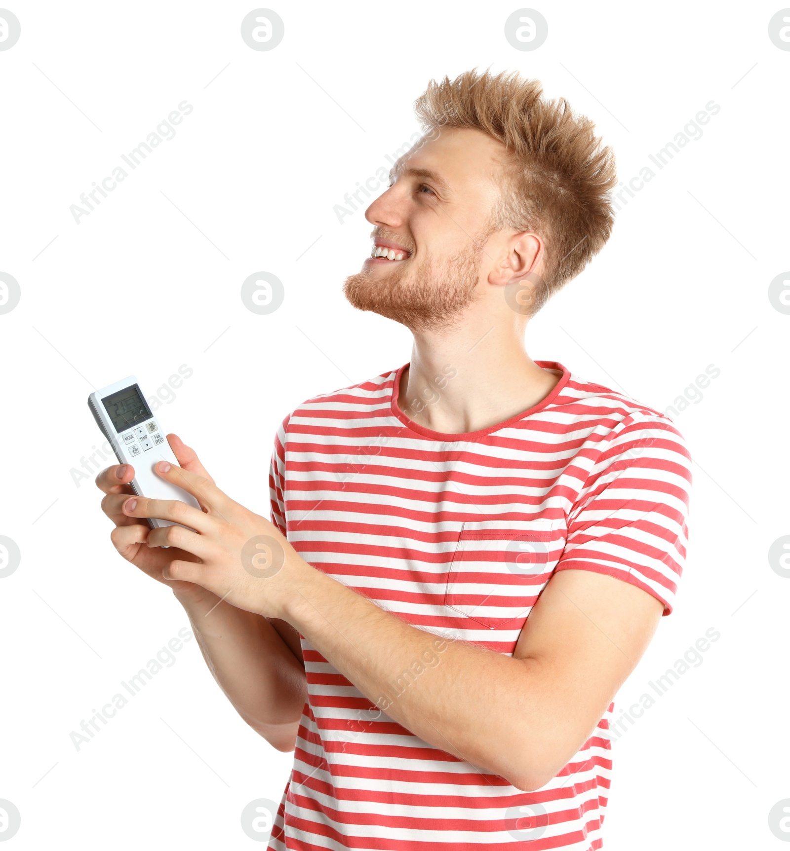 Photo of Young man with air conditioner remote on white background