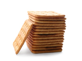 Photo of Stack of delicious crispy crackers isolated on white