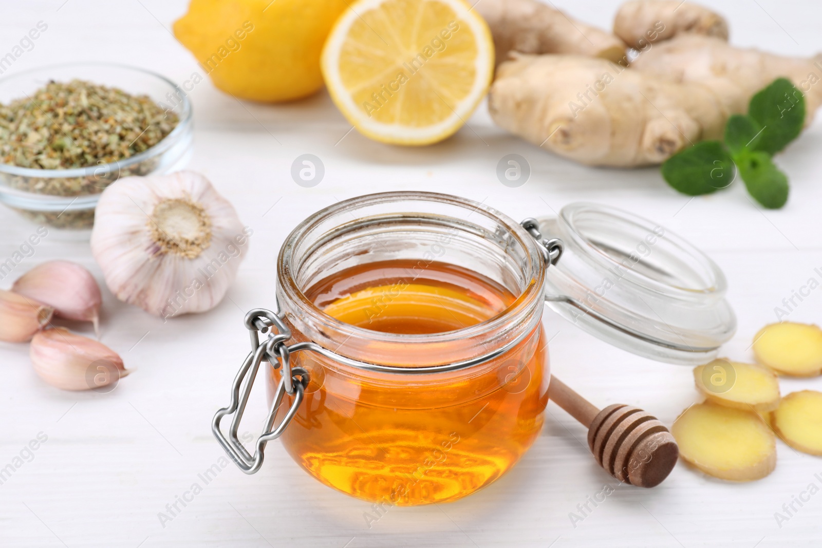 Photo of Different natural cold remedies on white table. Cough treatment