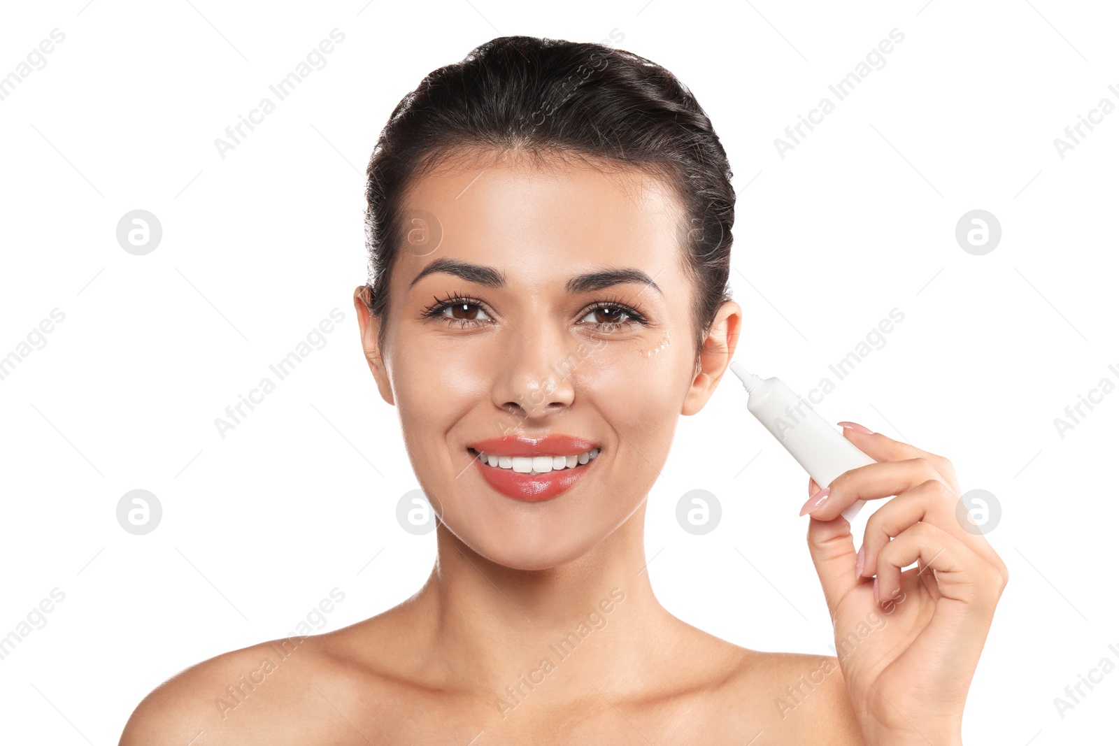 Photo of Woman applying cream under eyes on white background. Skin care