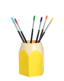 Photo of Brushes with colorful paints in holder on white background