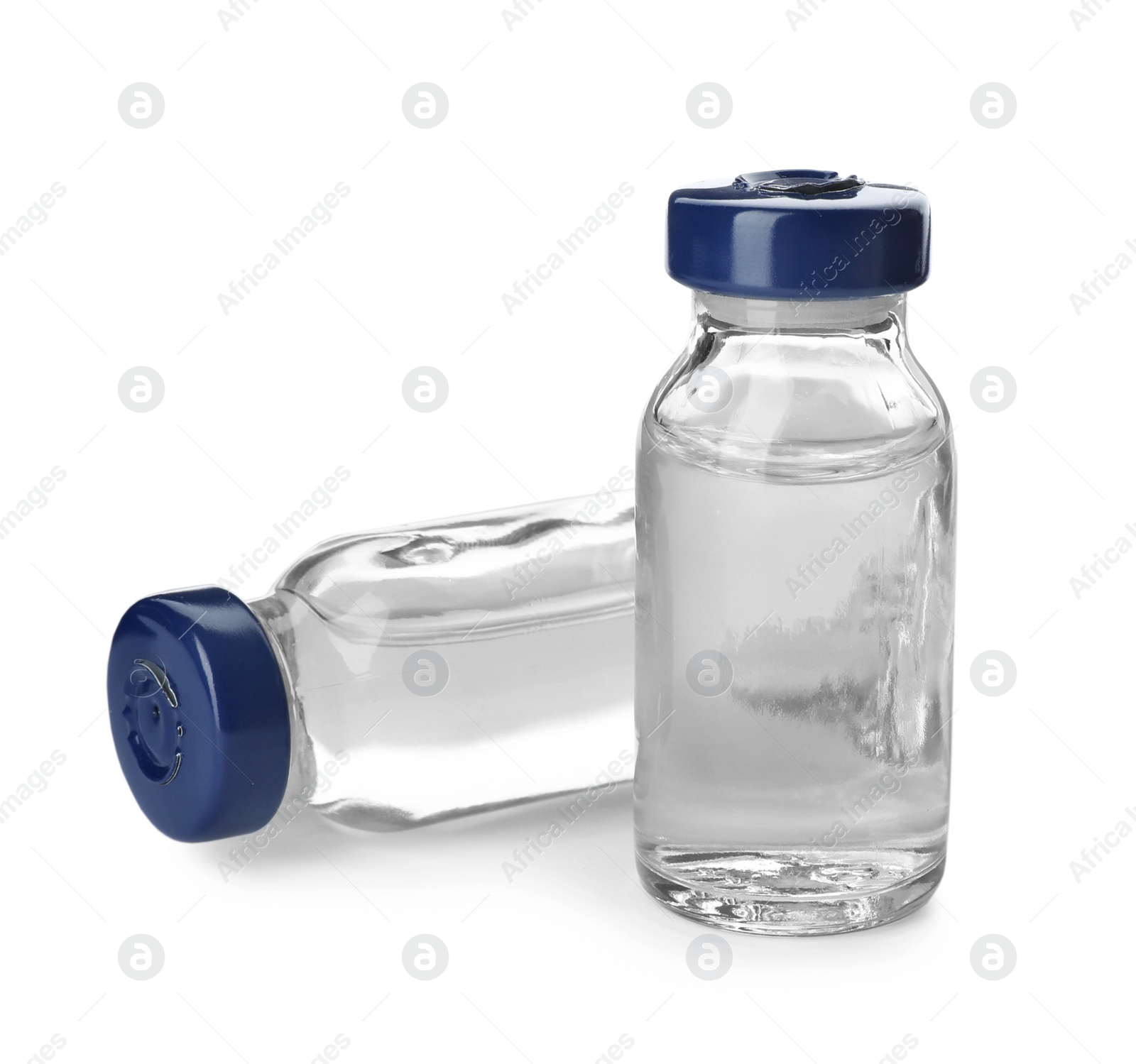 Photo of Medical vials with solution for injection on white background