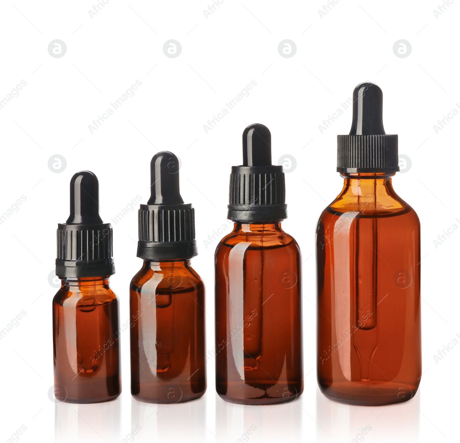 Photo of Cosmetic bottles of essential oils on white background