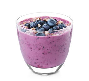 Glass of tasty blueberry smoothie with muesli on white background