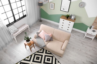 Living room interior with comfortable sofa, view through CCTV camera