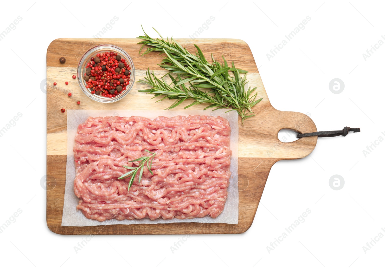 Photo of Raw chicken minced meat with spices and rosemary on white background, top view