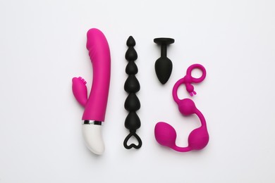 Photo of Sex toys on white background, flat lay