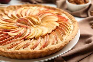 Photo of Delicious homemade apple tart on table, closeup