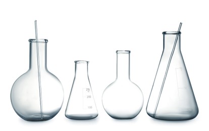 Photo of Empty clean laboratory glassware on white background