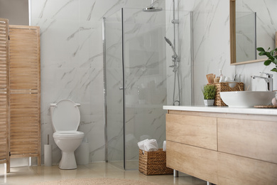 Photo of Interior of stylish bathroom with shower unit