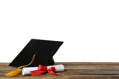 Graduation hat and diploma on wooden table against  white background, space for text