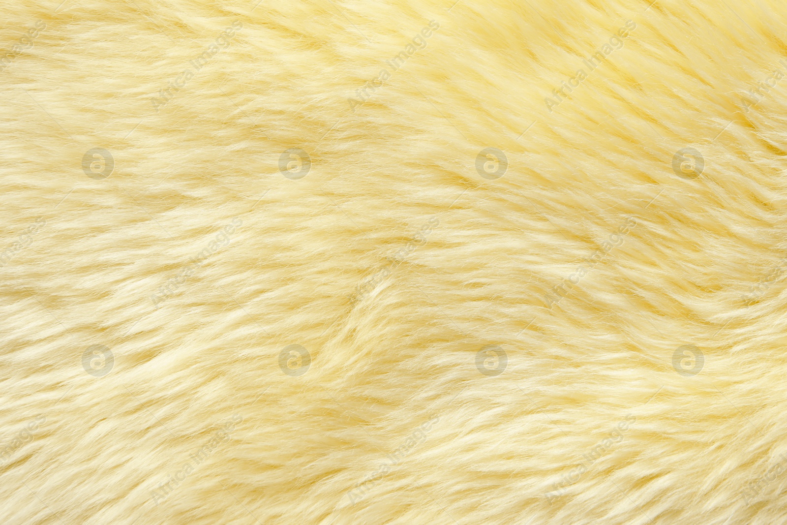 Image of Texture of yellow faux fur as background, closeup