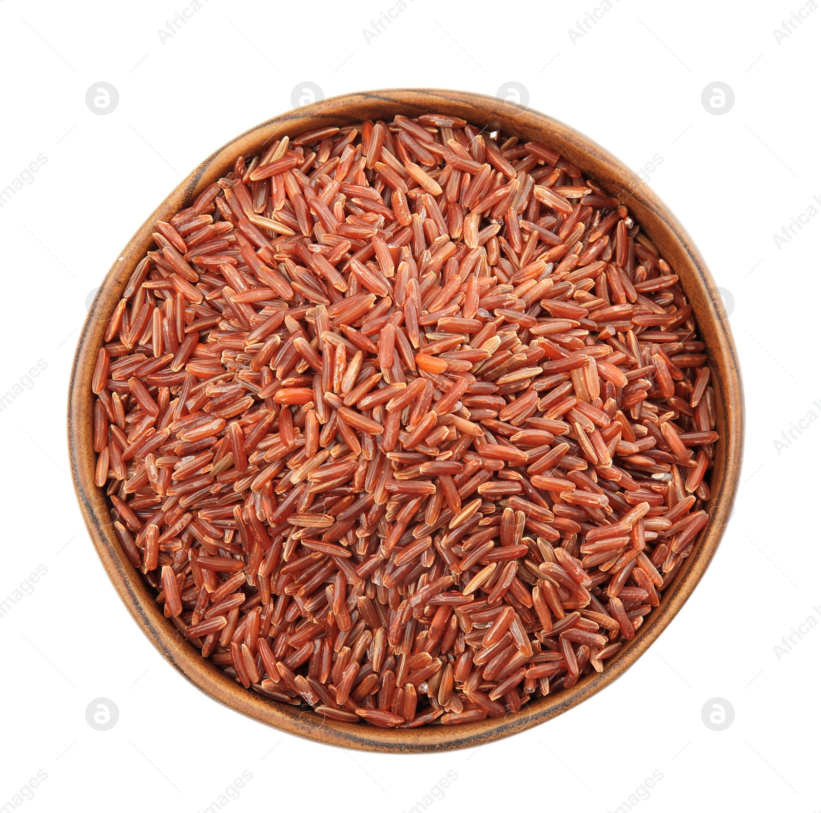 Photo of Bowl with uncooked red rice on white background, top view