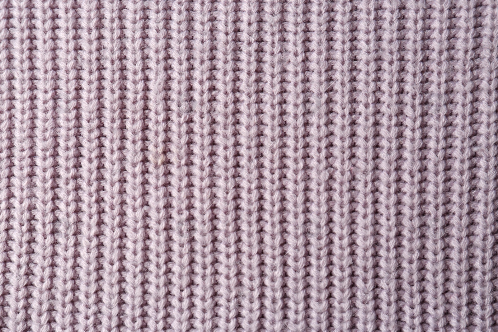 Photo of Beautiful violet knitted fabric as background, top view