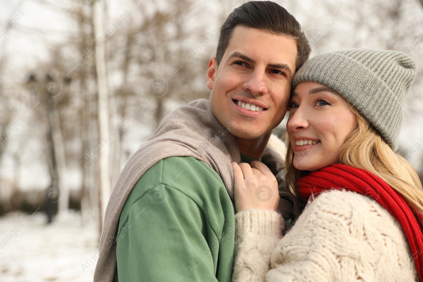 Photo of Beautiful happy couple outdoors on winter day